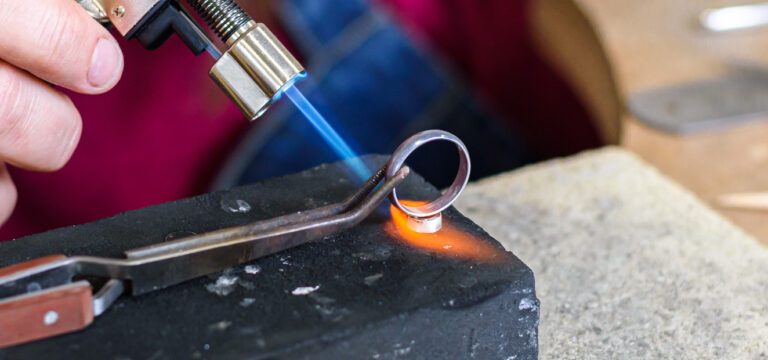 Silver setting being soldered to silver ring