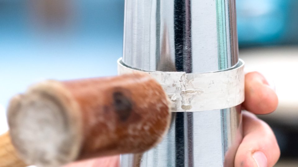 Hammering silver bangle on a bangle mandrel