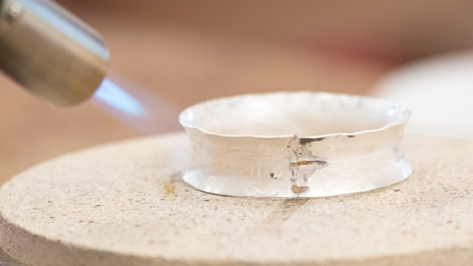 Anticlastic bangle being annealed