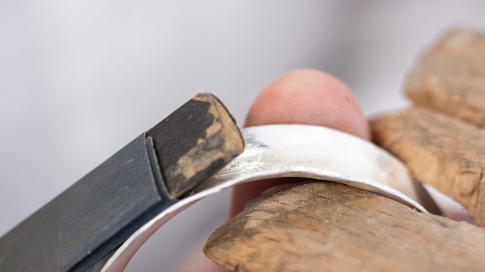 Anticlastic bangle being sanded