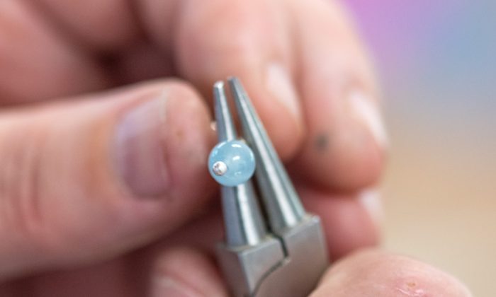 Adding an aquamarine semi precious bead to the silver earring